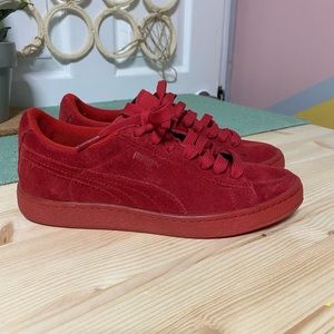 Red suede pumas